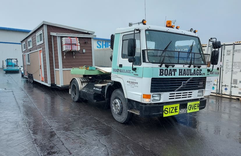 boat haulage with loaded tiny home